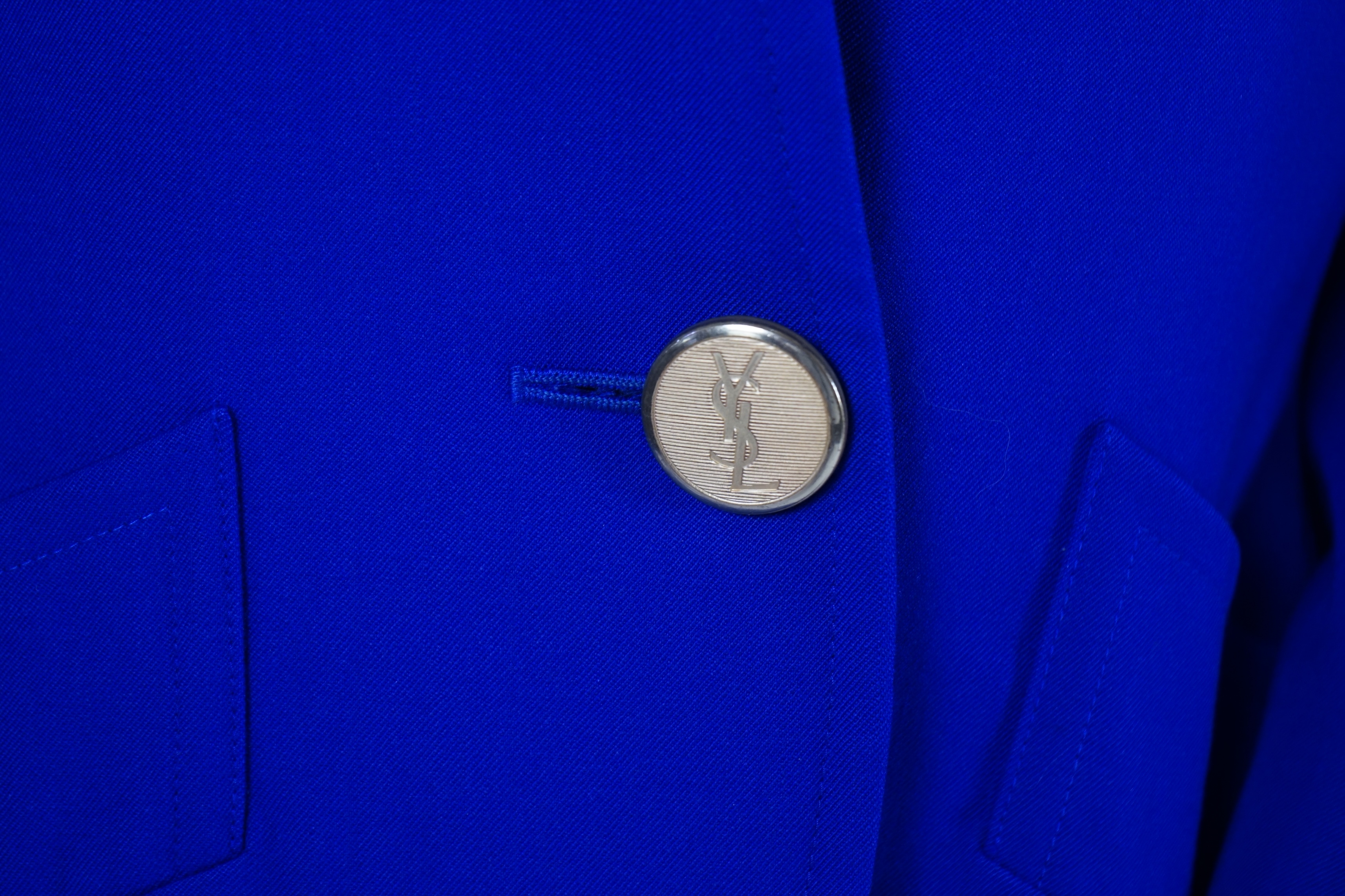 Two vintage Yves Saint Laurent variation lady's skirt suits, royal blue and orange. F 40 (UK 12).Please note alterations to make the waist smaller may have been carried out on some of the skirts. Proceeds to Happy Paws P